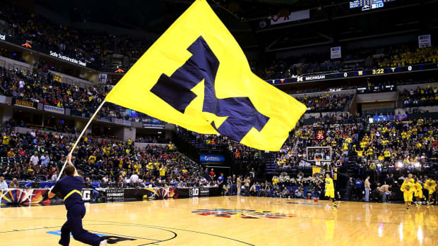 A University of Michigan flag is seen on the court prior to the 2014 Big Ten Men's Championship between the Michigan Wolverines and the Michigan State Spartans.
