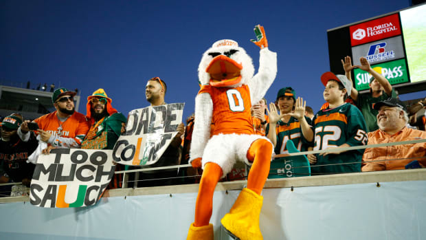 The Miami Hurricanes mascot interacting with fans.