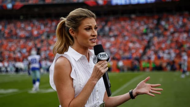 erin andrews works the sideline during a game