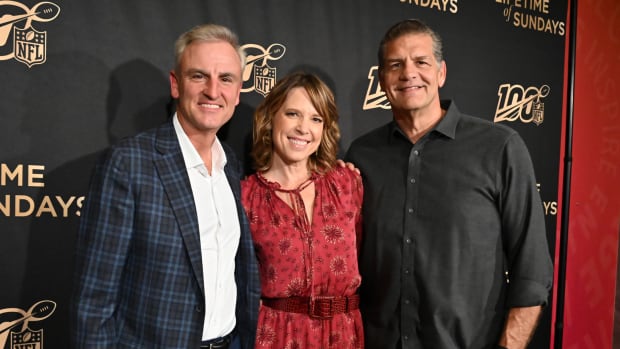 ESPN's Trey Wingo, Hannah Storm, and Mike Golic at an event.