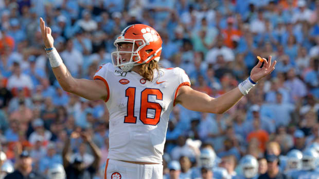 Trevor Lawrence throws up his hands during a college football game at North Carolina. He is the favorite to be the No. 1 pick in the 2021 NFL Draft as of now.