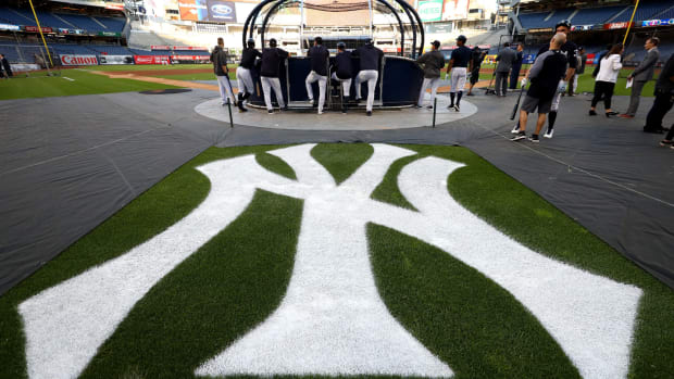 A view of the Yankees logo behind home plate of Yankee Stadium.