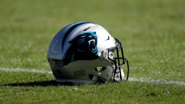 A picture of a Carolina Panthers helmet on the field.