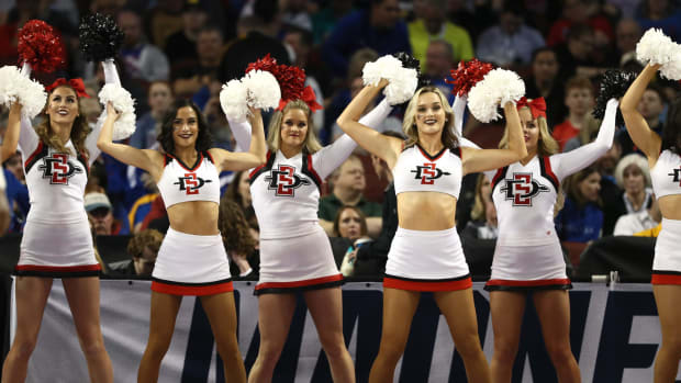 San Diego State cheerleaders performing during a basketball game.