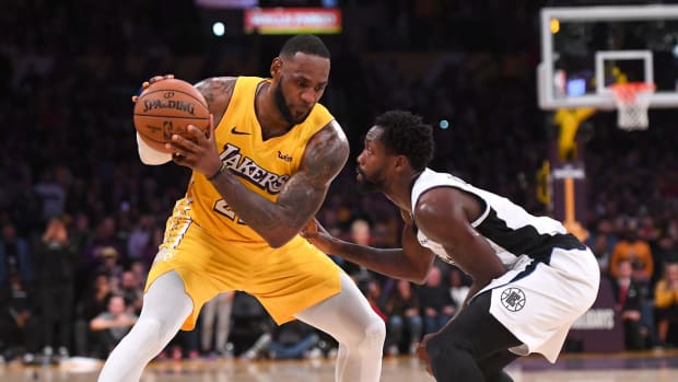 Patrick Beverley guards LeBron James at STAPLES Center on Wednesday.