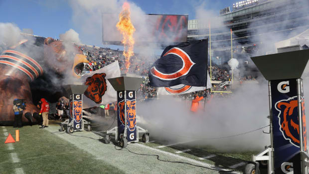 A picture being taken as the Chicago Bears run onto the field.