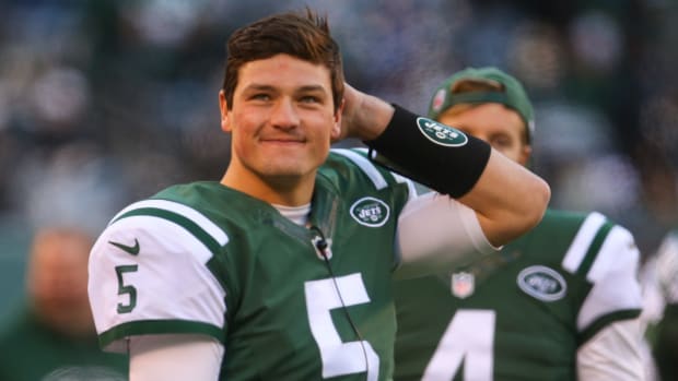 christian hackenberg looks onto the field during an nfl game