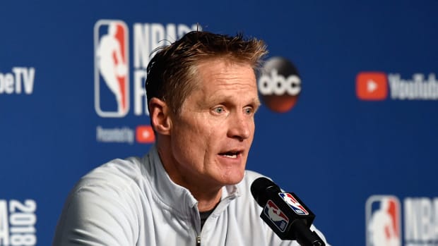 Golden State Warriors coach Steve Kerr speaking to the media. Kerr is an outspoken critic of President Donald Trump and his policies.