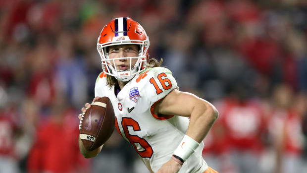 Trevor Lawrence rolls out in the first half against Ohio State.