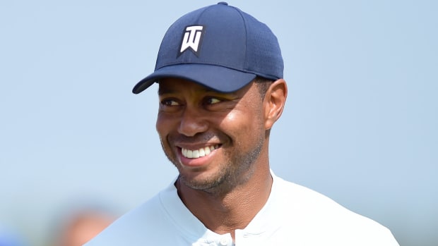 Tiger Woods smiles at the Northern Trust.