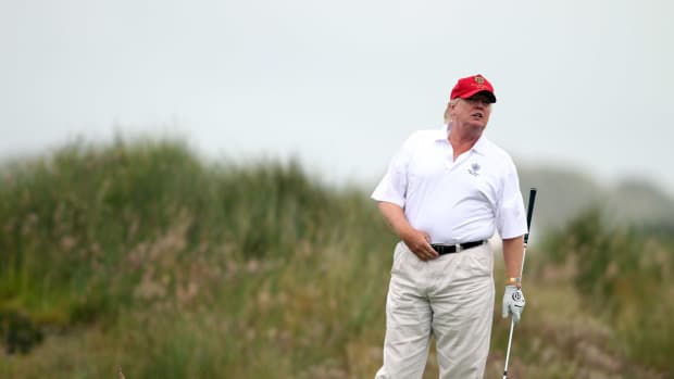 president donald trump playing golf