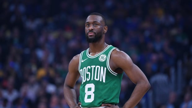 Kemba Walker stands on the court during a game for the Boston Celtics.