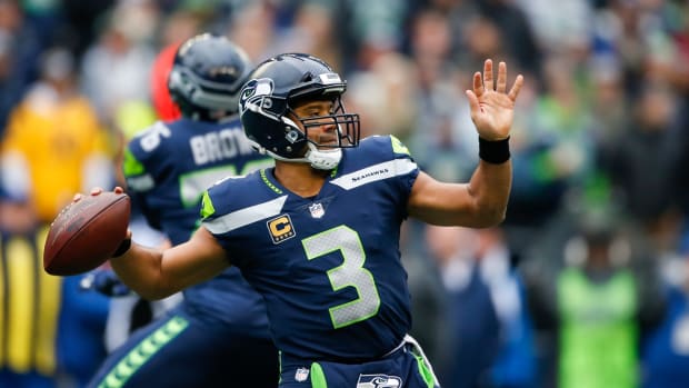 Russell Wilson winding up to pass.