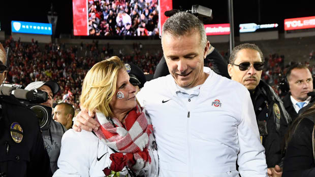urban meyer and his wife shelley meyer after the rose bowl