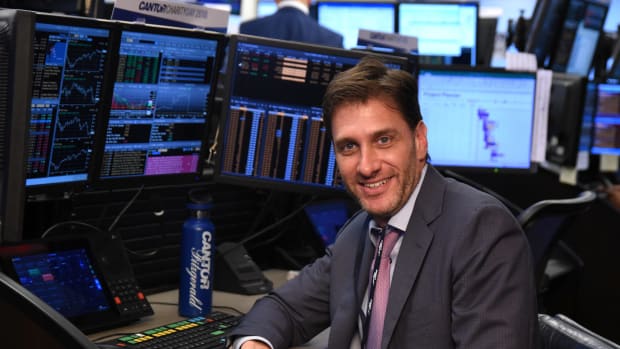 ESPN star and diehard New York Jets fan Mike Greenberg sitting at a computer.