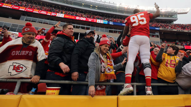 Chris Jones celebrates with Chiefs fans in the stands.
