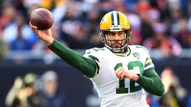 Green Bay Packers QB Aaron Rodgers throwing a pass.