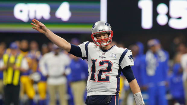 New England Patriots QB Tom Brady reacting during a football game.
