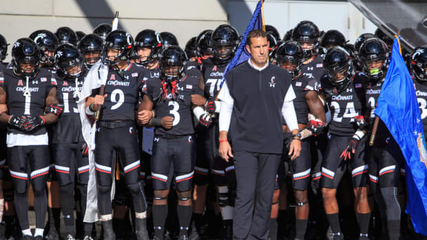Luke Fickell and the Cincinnati Bearcats prepare to walk out onto the field.