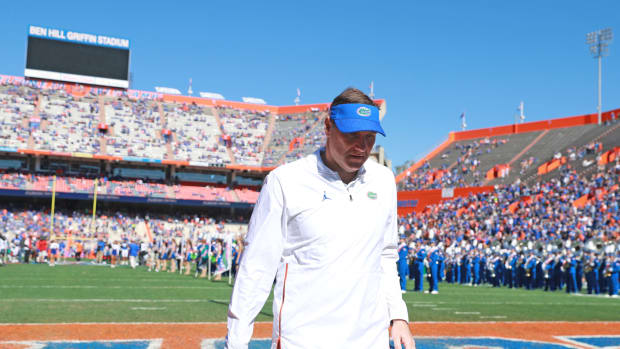 Florida football coach Dan Mullen walking off the field.