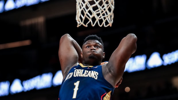 Zion Williamson attempts a dunk for the New Orleans Pelicans.