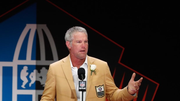 Bret Favre speaking at an event.