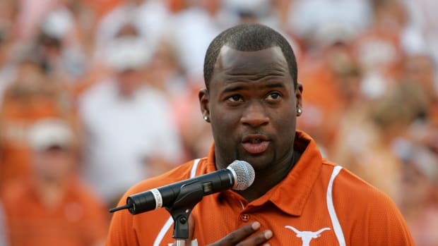 Vince Young speaking into a microphone during a Texas Longhorns game.
