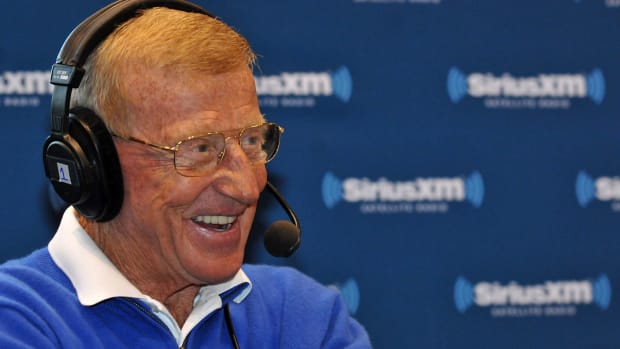 A closeup of Lou Holtz speaking to the media.