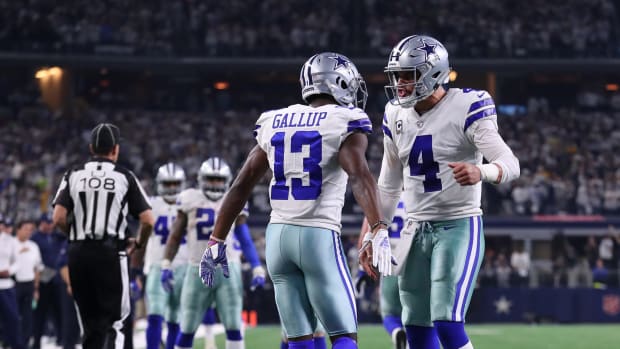 Dallas Cowboys star Michael Gallup celebrates with Dak Prescott during a game against the Seattle Seahawks in the playoffs.