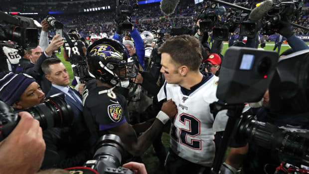Lamar Jackson and Tom Brady greet each other after the Ravens beat the Patriots.