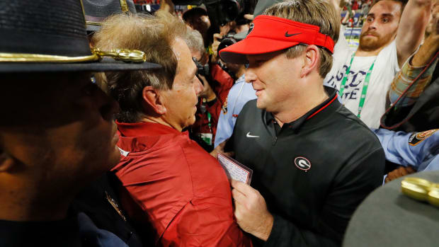 Kirby Smart and Nick Saban speaking after a n SEC Championship football game.
