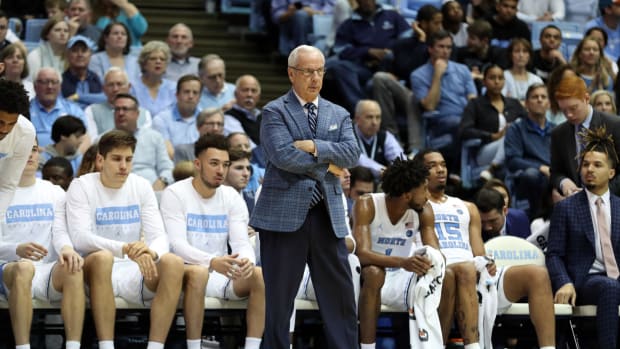 Roy Williams stands in front of the North Carolina bench during a loss vs. Clemson.