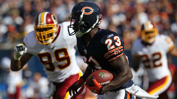Devin Hester running with the football.