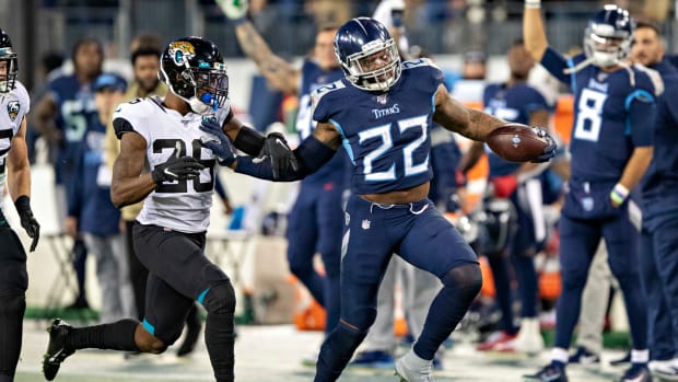 Derrick Henry runs the football for the Tennessee Titans.