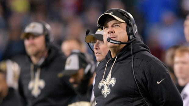 A closeup of New Orleans Saints coach Sean Payton wearing a black visor.