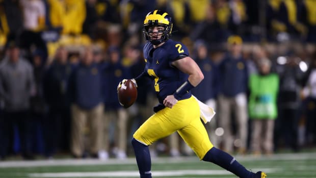 Shea Patterson of the Michigan Wolverines looks to pass.