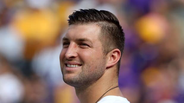 Tim Tebow on the field before a game.