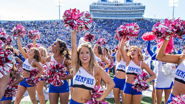Pom Squad of the Memphis Tigers celebrate with the fans after a game against the Ole Miss Rebels at Liberty Bowl Memorial Stadium.