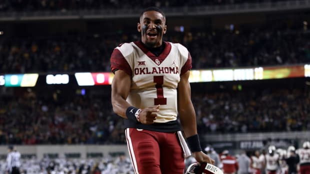 College football star Jalen Hurts celebrates Oklahoma's win against Baylor on Saturday night.