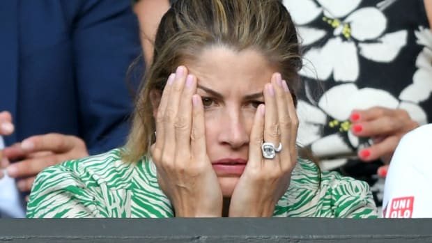 Mirka Federer watches in angst as Roger Federer plays at Wimbledon.
