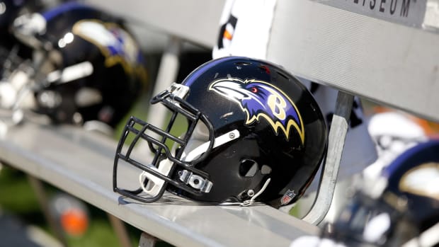 A Baltimore Ravens helmet sitting on a bench.