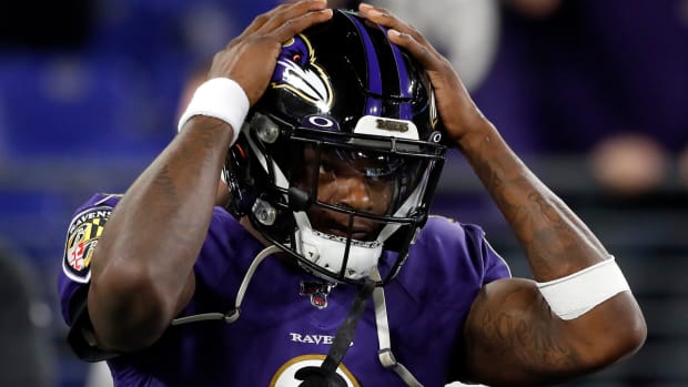 Baltimore Ravens quarterback Lamar Jackson is stunned by an interception against the Titans.