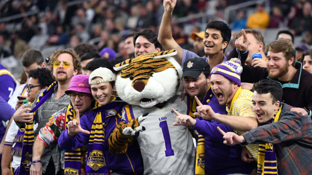 LSU's mascot celebrating with fans.