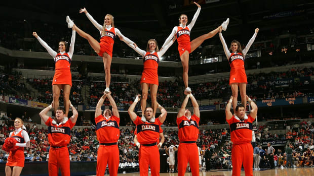 Illinois cheerleaders performing during a basketball game.
