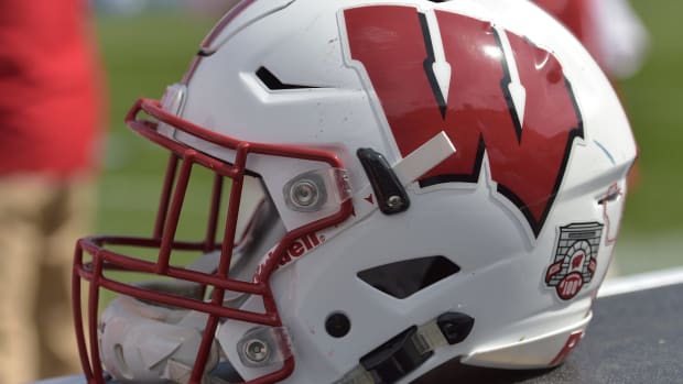 A closeup of a Wisconsin Badgers football helmet.