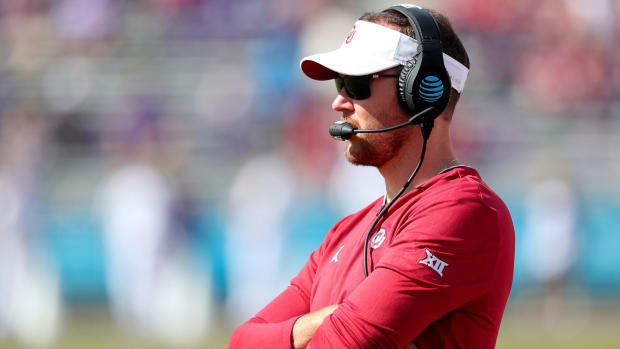 A closeup of Oklahoma Sooners coach Lincoln Riley during a game.