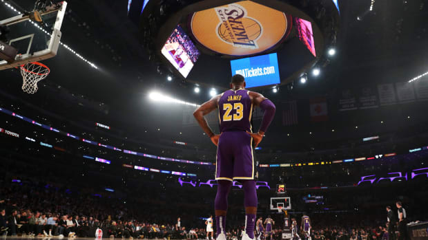 LeBron James stands at the baseline in Staples Center during a Lakers game.