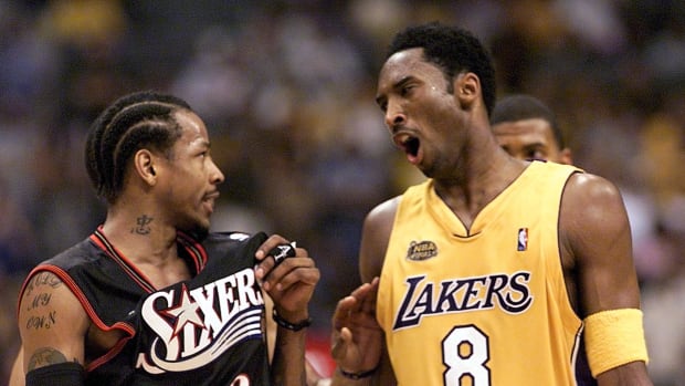 Allen Iverson and Kobe Bryant speak on the court during the NBA Finals.