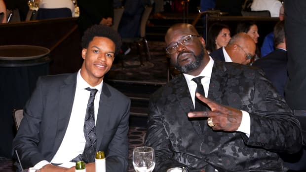 Shareef O'Neal and his father Shaq at a dinner.