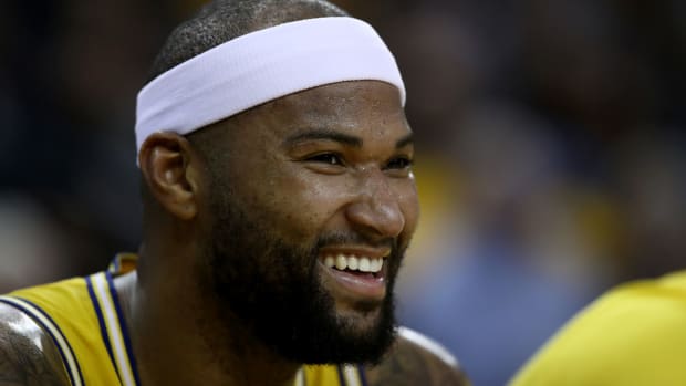 A closeup of DeMarcus Cousins laughing during a game.